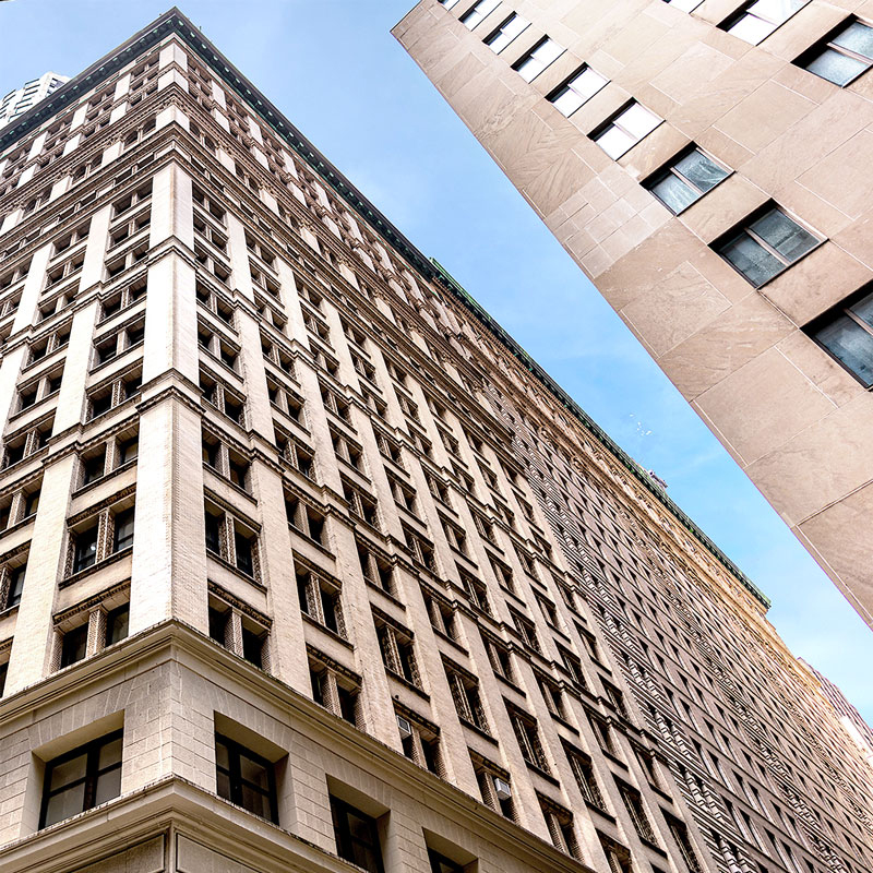 The exterior of 40 Exchange Place in NYC showing façade restoration by Avarga Construction Corp.