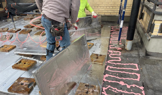 Roofing Solutions for NYC’s Ever-Changing Climate 9 installing high quality roofing materials